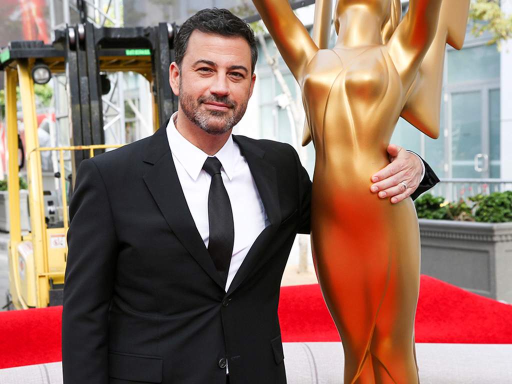 This Sept. 14, 2016 file photo shows host Jimmy Kimmel posing for a photo with a replica of an Emmy statue at the Primetime Emmy Awards Press Preview Day in Los Angeles, Calif.