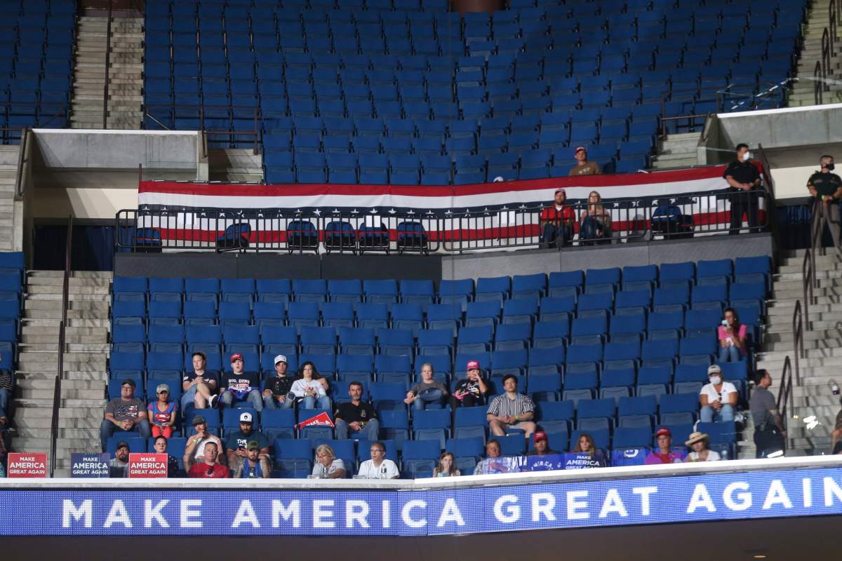 Attendees watch as Vice President Mike Pence speaks during a campaign rally for President Donald Trump at BOK Center in Tulsa, Okla., June 20, 2020.