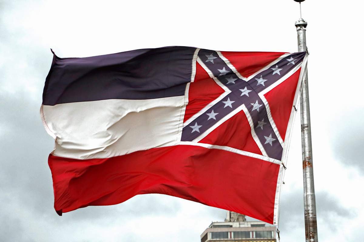 A Mississippi state flag flies outside the Capitol in Jackson, Miss., on June 25, 2020.