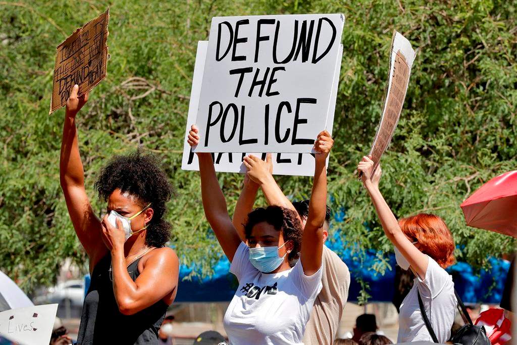 Protesters rally Wednesday, June 3, 2020, in Phoenix, Ariz., demanding the Phoenix city council defund the Phoenix Police Department.