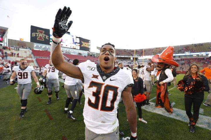Oklahoma State running back Chuba Hubbard blows a kiss to the Oklahoma State fans after their 34-27 win over Iowa State after an NCAA college football game, Saturday, Oct. 26, 2019, in Ames, Iowa. 