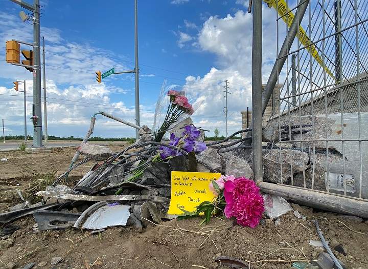 A growing memorial at the scene of a fatal crash in Brampton that killed a mother and her three young daughters.