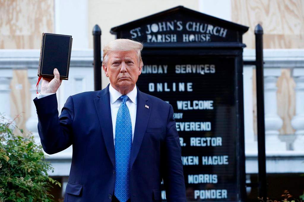 President Donald Trump holds a Bible as he visits outside St. John\’s Church across Lafayette Park from the White House Monday, June 1, 2020, in Washington. Park of the church was set on fire during protests on Sunday night.