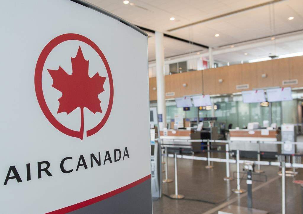 An Air Canada check-in area is shown at Montreal-Pierre Elliott Trudeau International Airport, Saturday, May 16, 2020.