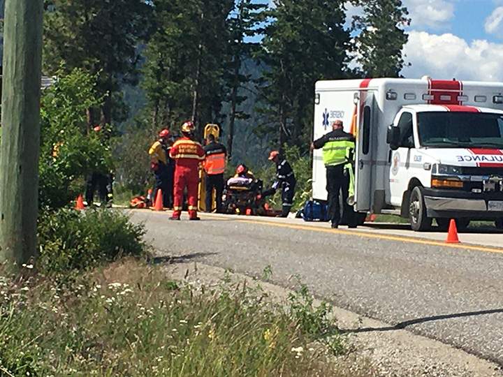 The motorcylist was placed onto a stretcher after being pulled from the embankment.