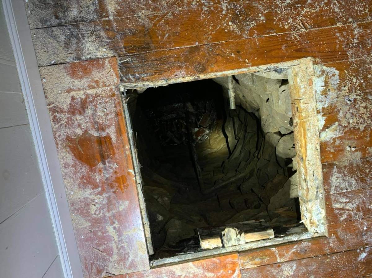 A hole leading to a hidden well is shown at a historic home in Guilford, Con., on June 28, 2020.