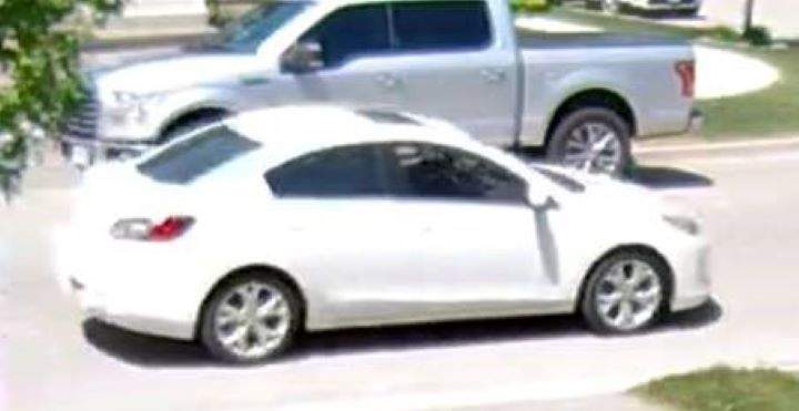 The suspect vehicle is a white, four-door Mazda.