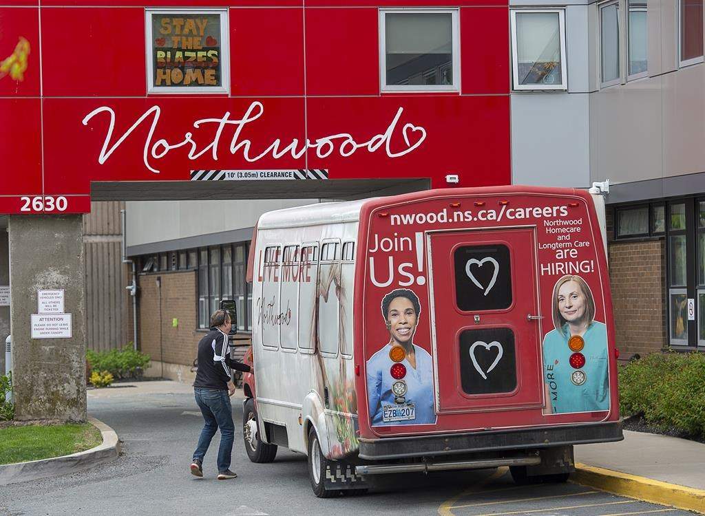 A driver enters a shuttle bus at Northwood Manor, one of the largest nursing homes in Atlantic Canada, in Halifax on Tuesday, June 2, 2020.