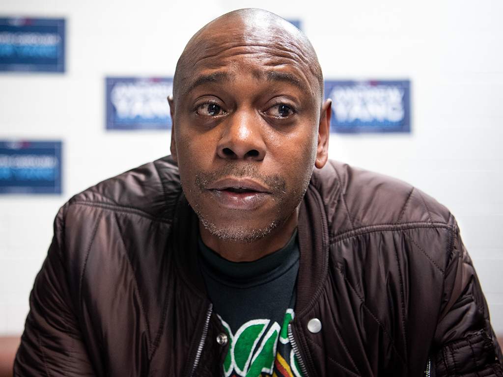 Comedian Dave Chappelle talks with the media while campaigning for Democratic presidential candidate Andrew Yang on Jan. 30, 2020 in North Charleston, S.C.