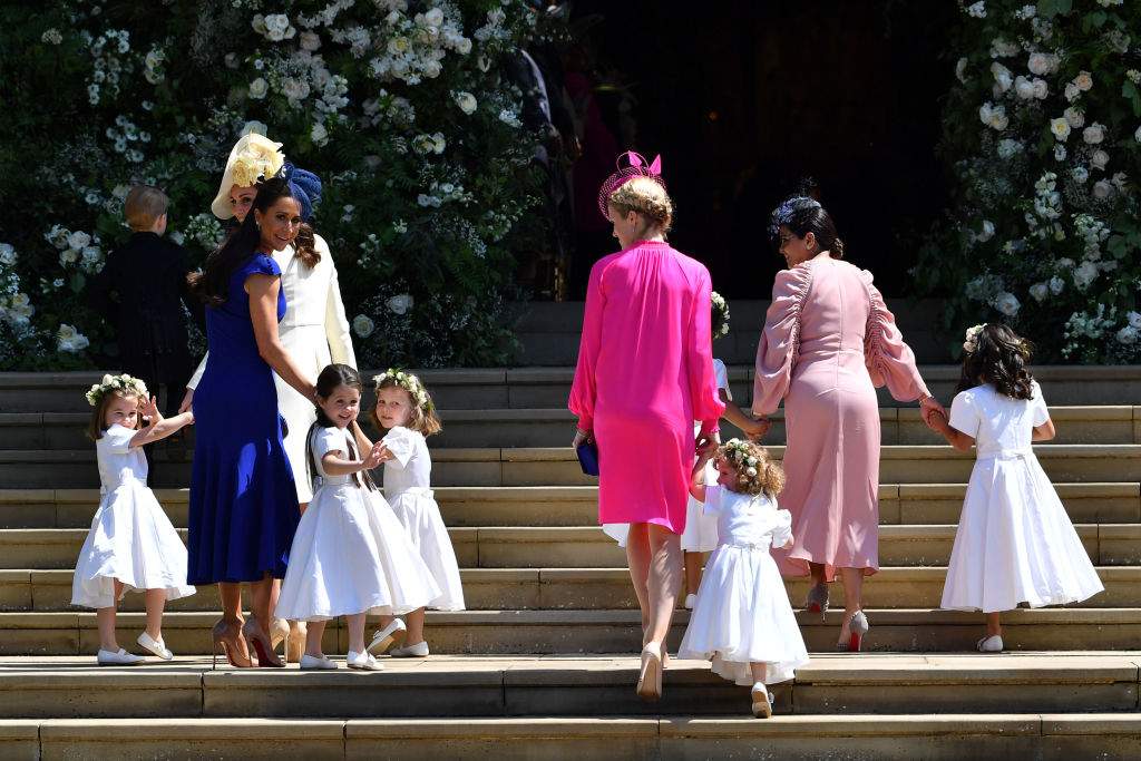 The Duchess of Cambridge and Meghan Markle’s friend, Canadian fashion stylist Jessica Mulroney (second left) holds flower girls’ hands as they arrive for the wedding ceremony of Prince Harry to Meghan Markle at St. George’s Chapel in Windsor Castle.