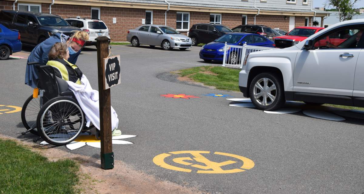 Family members visit a loved one at the Glen Haven Manor in New Glasgow, N.S. on June 15, 2020 — the first day visits have been allowed in Nova Scotia since the pandemic lock down began.