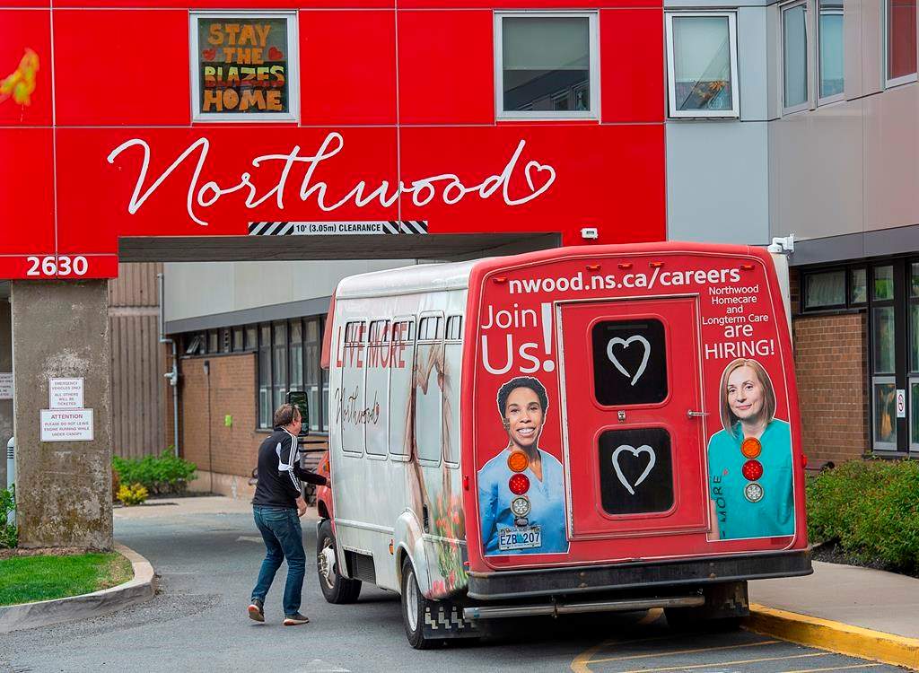 A driver enters a shuttle bus at Northwood Manor, one of the largest nursing homes in Atlantic Canada, in Halifax on Tuesday, June 2, 2020.