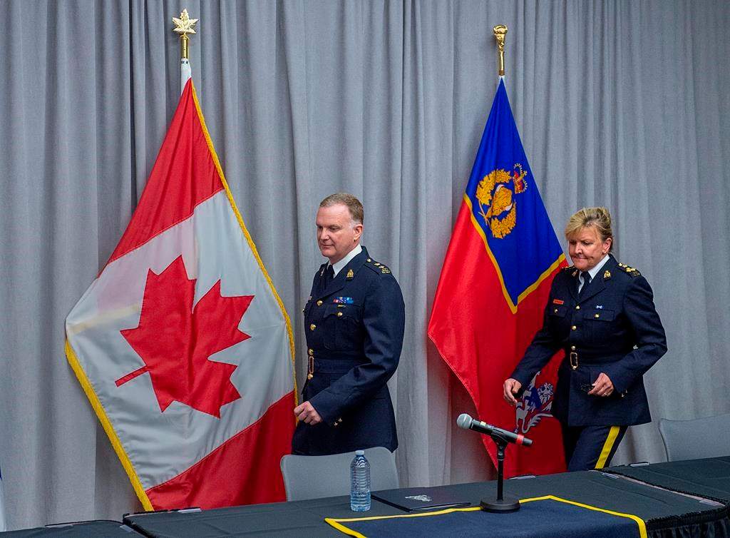 RCMP Supt. Darren Campbell, left, and Assistant Commissioner Lee Bergerman arrive at an media update of the investigation of the Nova Scotia shootings at RCMP headquarters in Dartmouth, N.S., Thursday, June 4, 2020.
