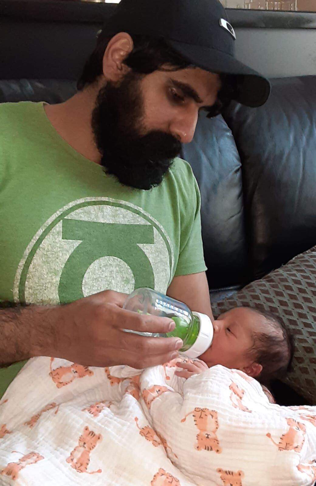 Ramanjit Saund with his newborn baby son. Photo provided by Ramanjit Saund.
