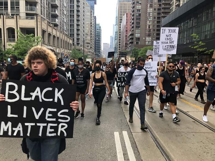 Anti-racism protesters march the streets of downtown Toronto.
