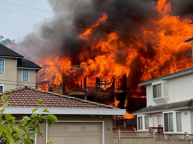 Fire engulfs a four-storey condo building at West 62 Avenue and Columbia Street in south Vancouver on June 18, 2020.