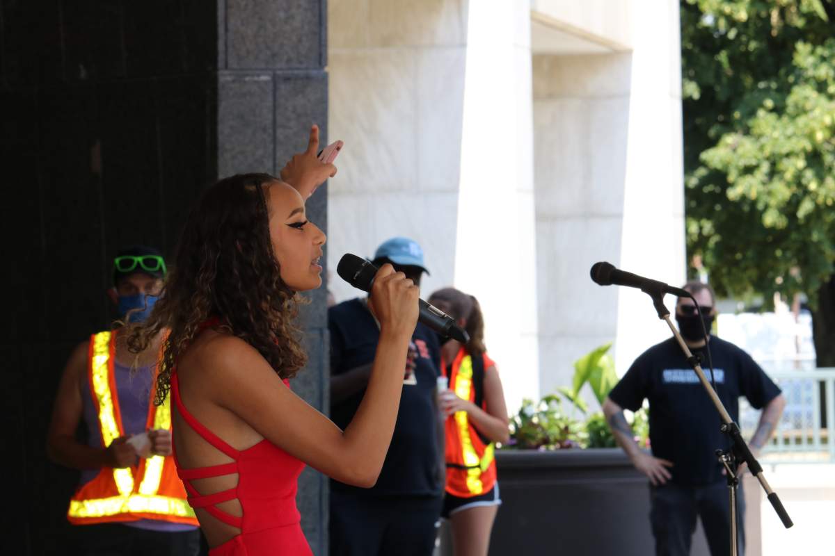Black Lives London co organizer Keira Roberts speaking to the crowd of people at the Black Lives Matter on the steps of London City Hall. June 20, 2020