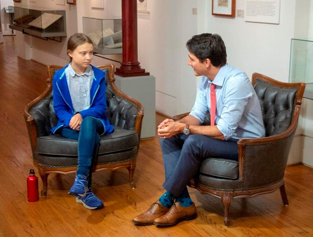 Canadian Prime Minister and Liberal leader Justin Trudeau speaks Swedish environmental activist Greta Thunberg in Montreal on September 27, 2019. Teenage climate activist Greta Thunberg is urging developing island nations to use the upcoming United Nations Security Council election to push Canada and Norway to step up their games on climate change. THE CANADIAN PRESS/Ryan Remiorz.
