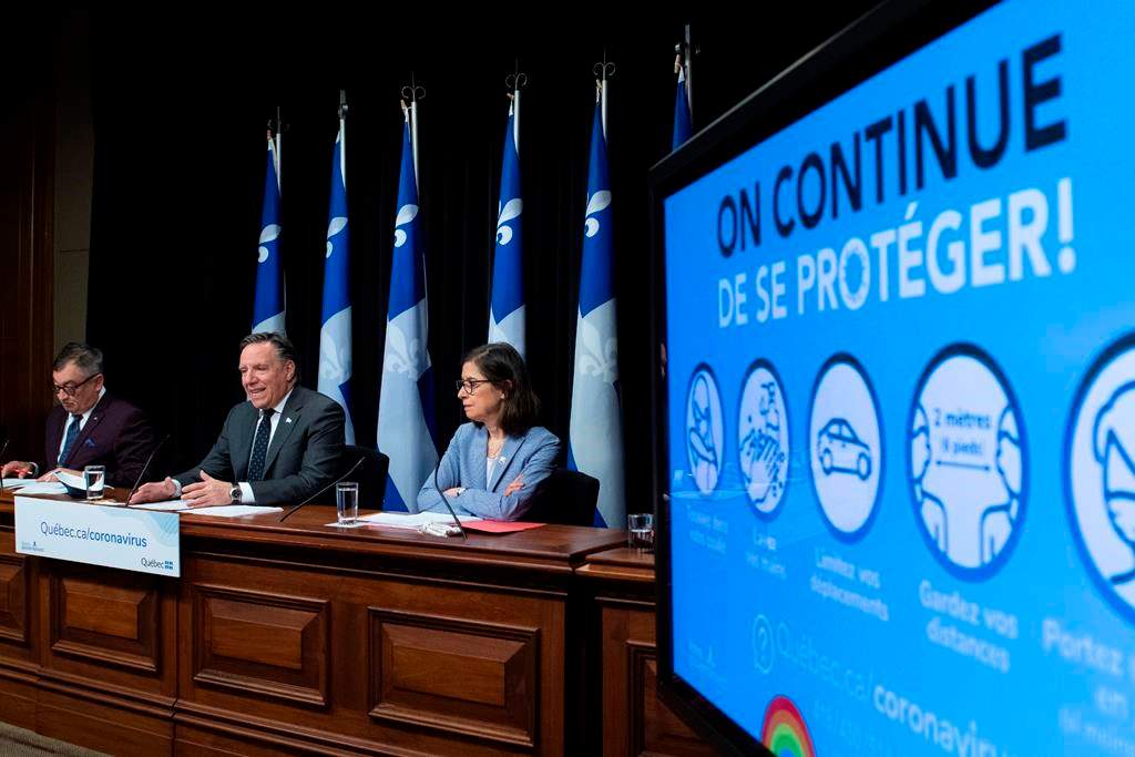 Quebec Premier Francois Legault, centre, Horacio Arruda, Quebec director of National Public Health, left, and Quebec Health Minister Danielle McCann during a news conference on the COVID-19 pandemic, Tuesday, June 9, 2020 at the legislature in Quebec City. THE CANADIAN PRESS/Jacques Boissinot.