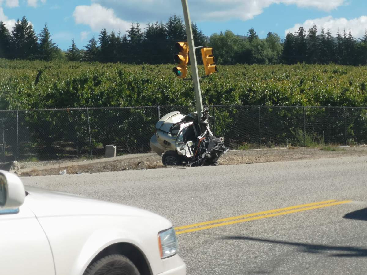 The car was split in half with one half wrapped around the pole it crashed into.