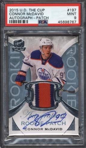 The 2015 UD The Cup Connor McDavid Rookie Auto Patch card that is up for auction, current priced at $70,000 USD.