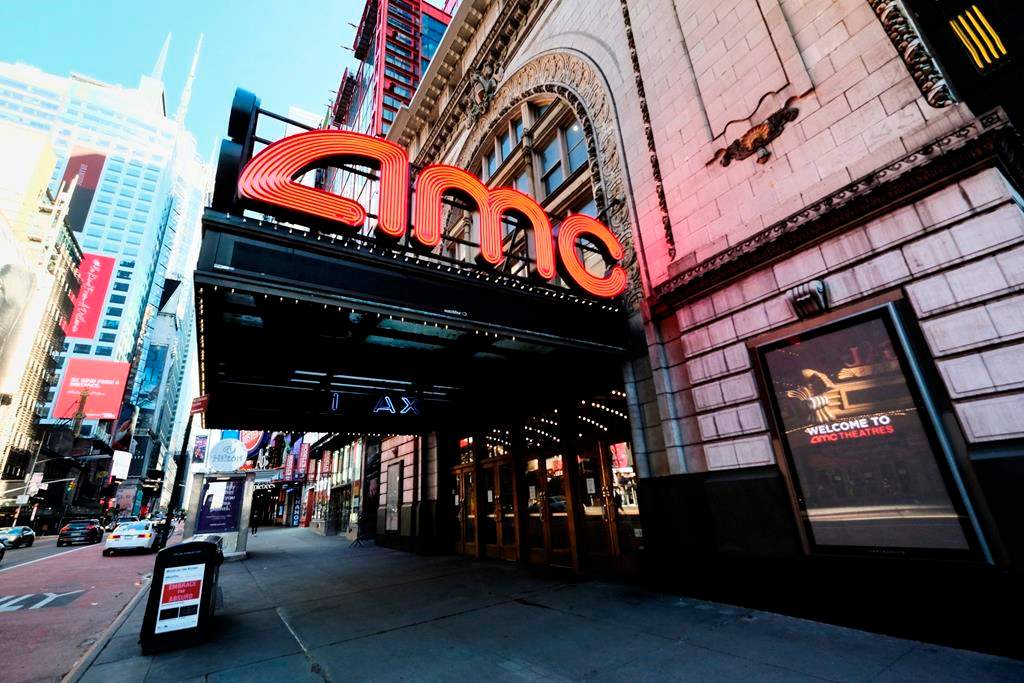 FILE - In this May 13, 2020 file photo, AMC Empire 25 theatre appears on 42nd Street in New York. The nation’s largest movie theater chain changed its position on mask-wearing less than a day after the company became a target on social media for saying it would defer to local governments on the issue. AMC Theaters CEO Adam Aron said Friday that its theaters will require patrons to wear masks upon reopening, which will begin in July. (Photo by Evan Agostini/Invision/AP, File).
