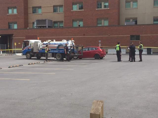 Calgary police on the scene of a crash involving a porta-potty truck in downtown Calgary.