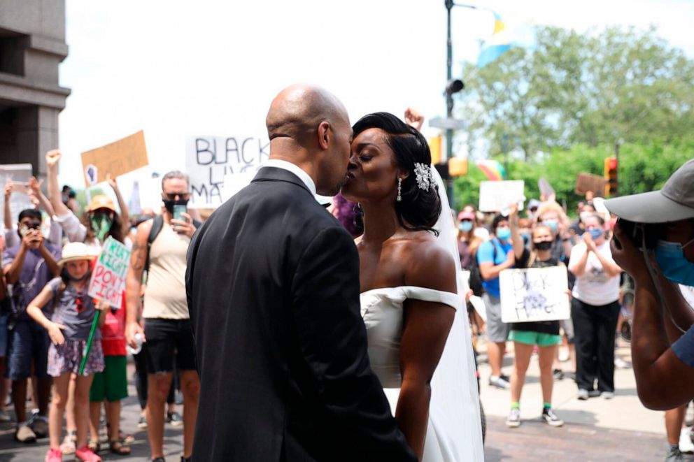 The newlyweds exited the Logan Hotel in their wedding attire, to a roar of applause and cheers from the crowd marching from the Philadelphia Museum of Art to City Hall.