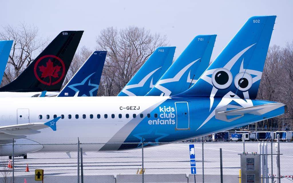 Air Transat and an Air Canada aircrafts are seen on the tarmac at Montreal-Trudeau International Airport in Montreal, on Wednesday, April 8, 2020.
