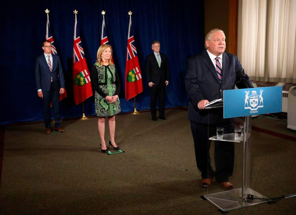 Ontario Premier Doug Ford holds his daily press conference at the Ontario Legislature at Queen's Park, Monday, June 22, 2020, joined by Christine Elliott, Deputy Premier and Minister of Health, Rod Phillips (right), Minister of Finance, and Monte McNaughton, (left) Minister of Labour, Training and Skills Development. THE CANADIAN PRESS/Richard Lautens -Pool.