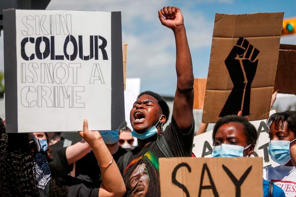 Protesters gather in solidarity with the George Floyd protests across the United States in Calgary, Alta., Wednesday, June 3, 2020.
