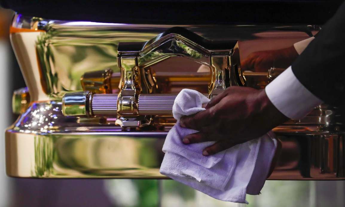 The casket is polished before the funeral for George Floyd on Tuesday, June 9, 2020, at The Fountain of Praise church in Houston.