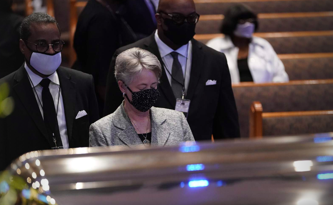Former Houston Mayor Annise Parker pauses by the casket of George Floyd during a funeral service for Floyd at The Fountain of Praise church, Tuesday, June 9, 2020, in Houston.