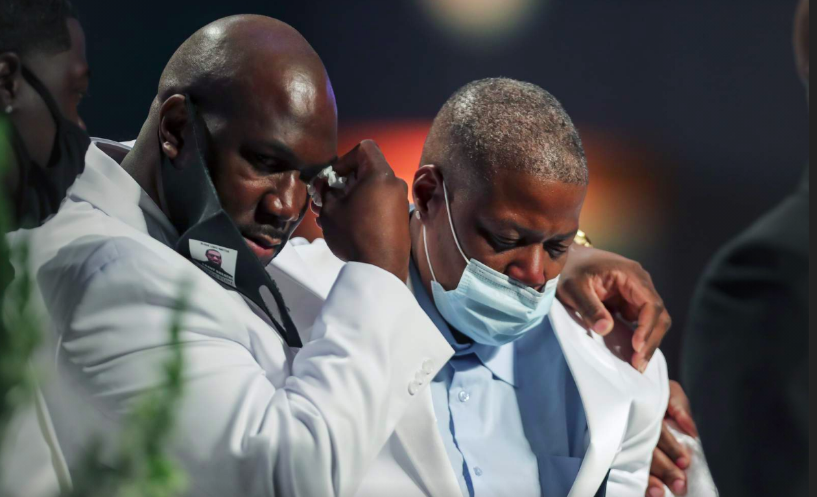 Philonise Floyd, left, puts his arm around his sister LaTonya Floyd as the family speaks during the funeral for George Floyd on Tuesday, June 9, 2020, at The Fountain of Praise church in Houston.