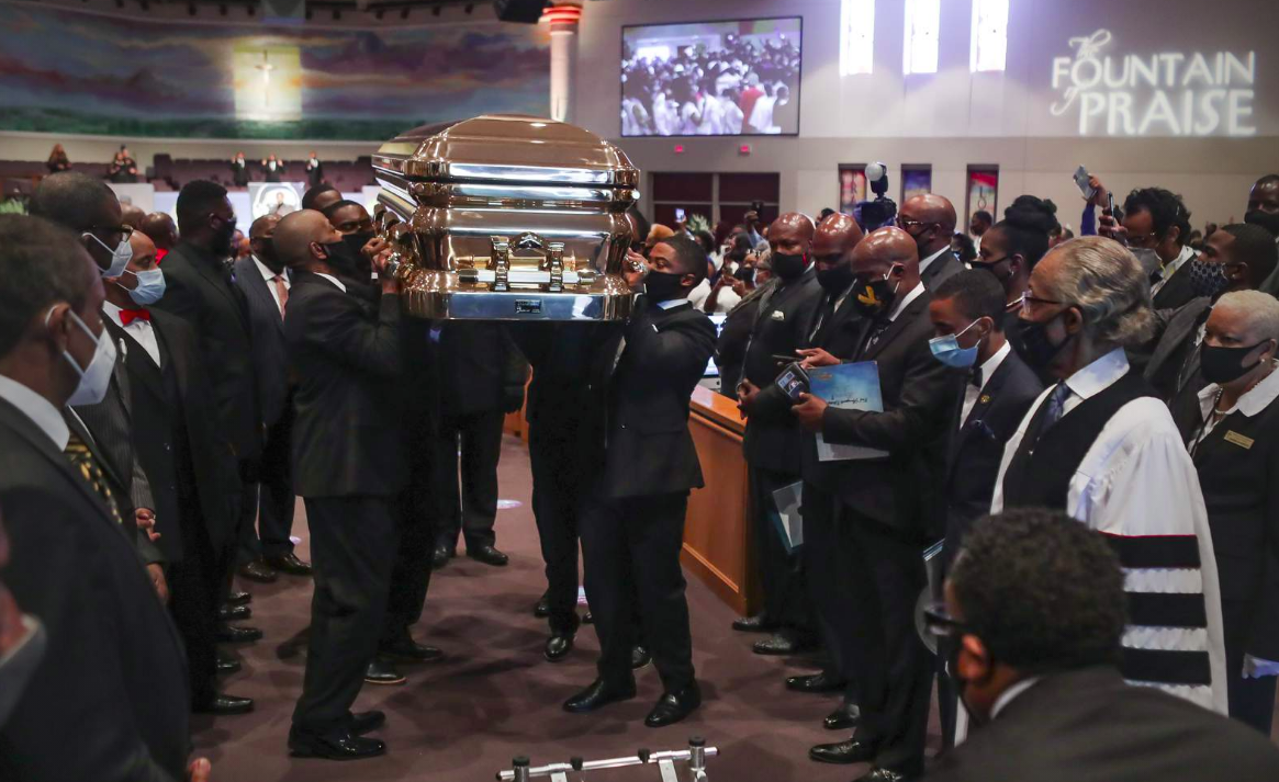 Pallbearers recess out of the church with the casket following the funeral for George Floyd on Tuesday, June 9, 2020, at The Fountain of Praise church in Houston.