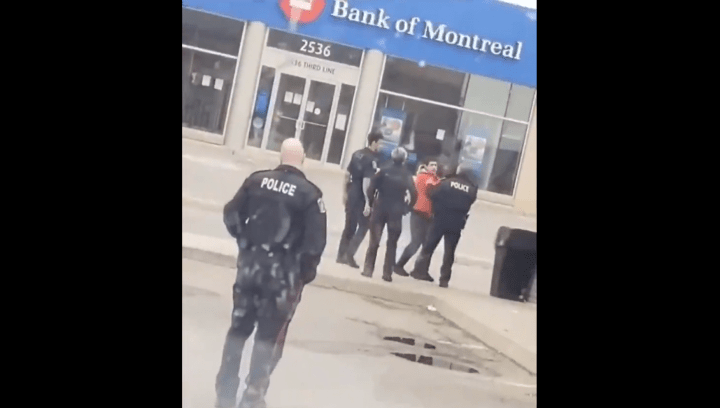 A video posted to social media on Saturday appears to show an officer repeatedly pushing a civilian.