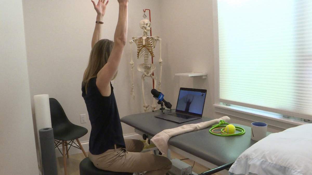 Physiotherapist Alison Beaton conducts a telehealth appointment with a patient.