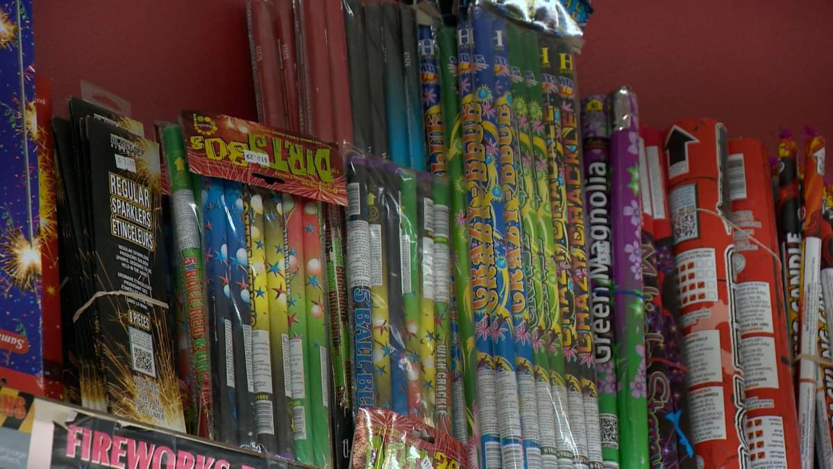 A shelf full of fireworks for sale.