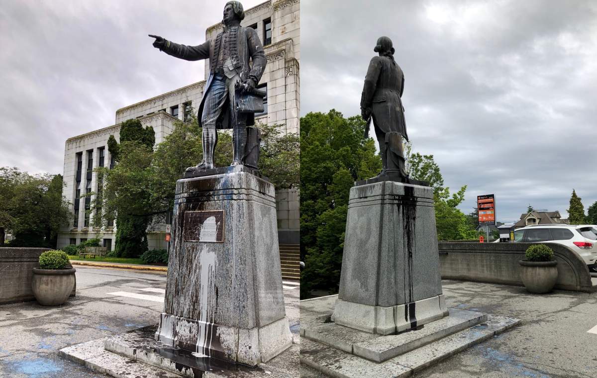 Paint splatters seen on a statue of George Vancouver in front of Vancouver City Hall on June 11, 2020. 