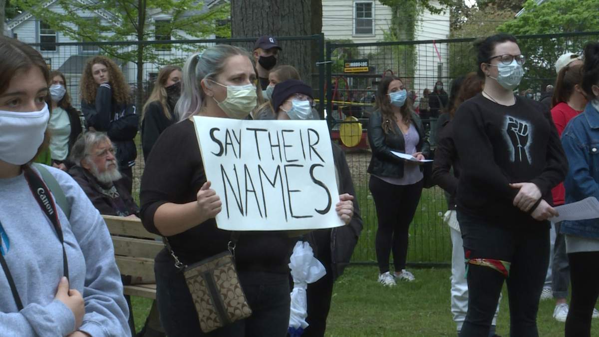 Many wore masks and held signs of support