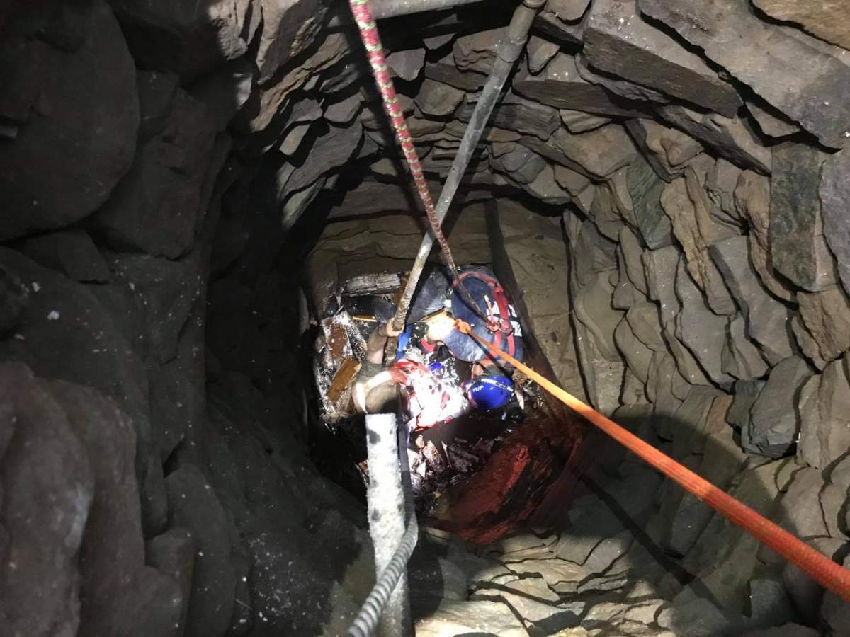 Members of the Guilford Fire Department rescue an individual who fell down a well beneath a historic house on June 28, 2020.