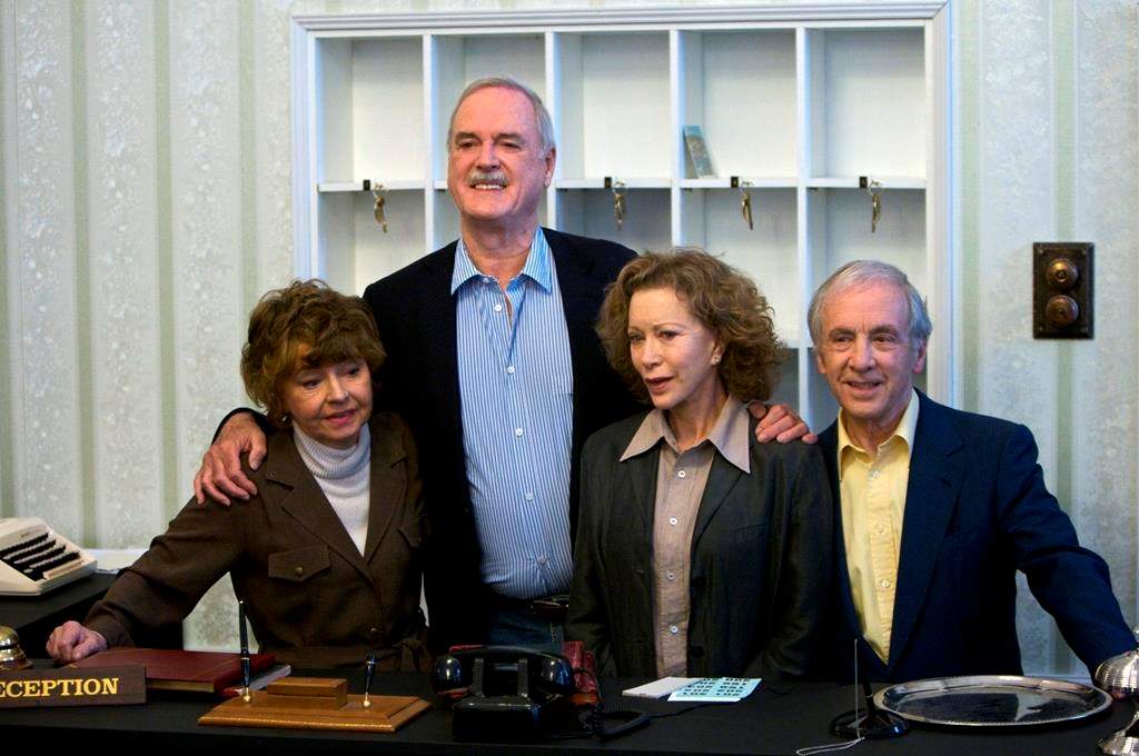 In this file photo dated Wednesday, May 6, 2009, the cast of Fawlty Towers from left, Prunella Scales, John Cleese, Connie Booth and Andrew Sachs reunite to celebrate the 30th anniversary of the TV show and mark a special program ‘Fawlty Towers: Re-opened’ at The Naval and Military Club, London, England.