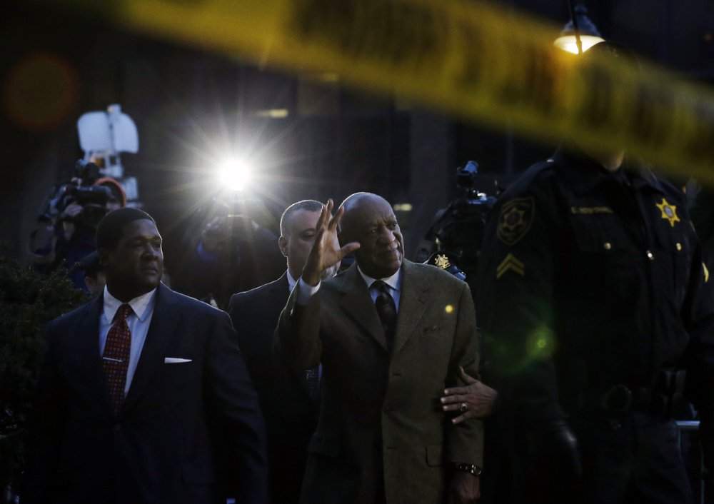 FILE - In this Feb. 2, 2016, file photo, Bill Cosby waves to cheering fans as he leaves after a court appearance in Norristown, Pa. Cosby was convicted of sexual assault in 2018. He is serving up to 10 years in prison. Now in the midst of another historic reckoning, this time addressing the treatment of African Americans and other people of color by police and the criminal justice system, the 82-year-old Cosby has won the right to an appeal.