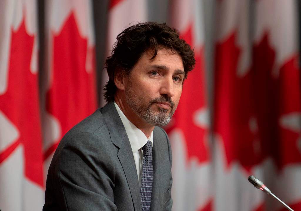 Prime Minister Justin Trudeau listens to a question during a news conference, Wednesday, July 8, 2020 in Ottawa.