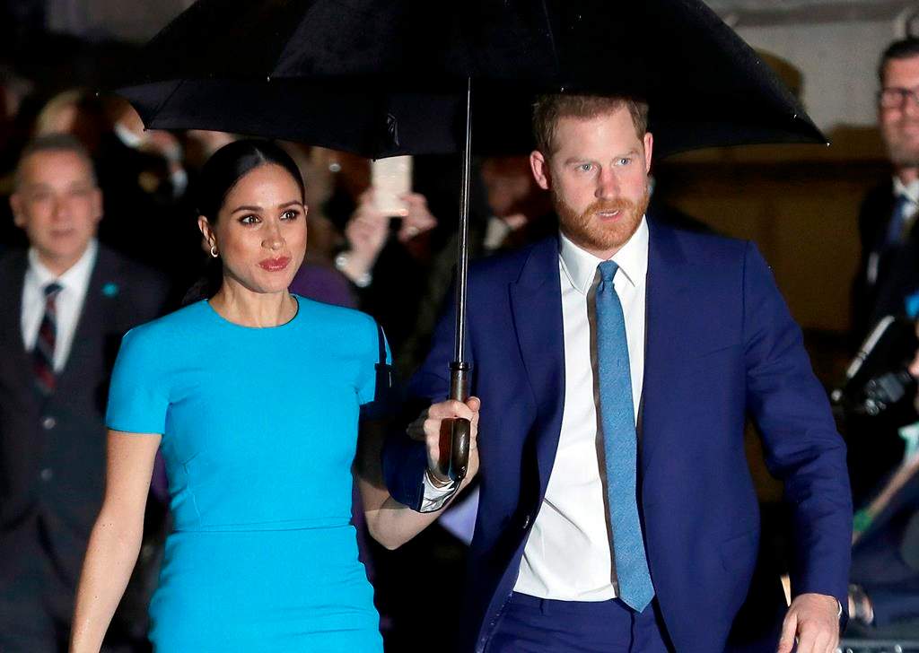 FILE - Prince Harry and Meghan, the Duke and Duchess of Sussex arrive at the annual Endeavour Fund Awards in London on March 5, 2020.