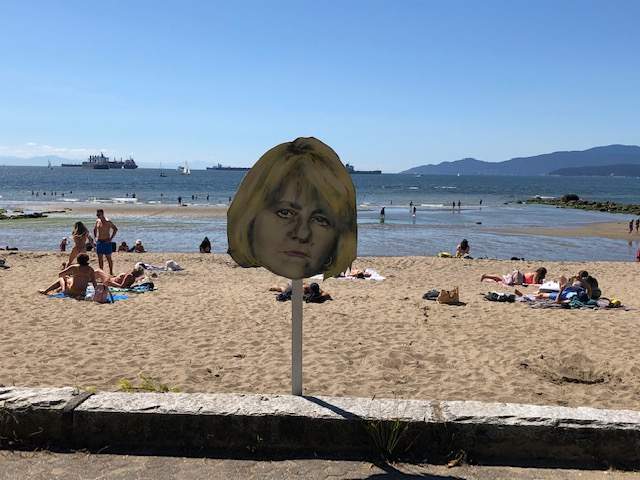 A cut-out image of Dr. Bonnie Henry keeps watch at Vancouver’s Third Beach on Saturday, July 26, 2020.