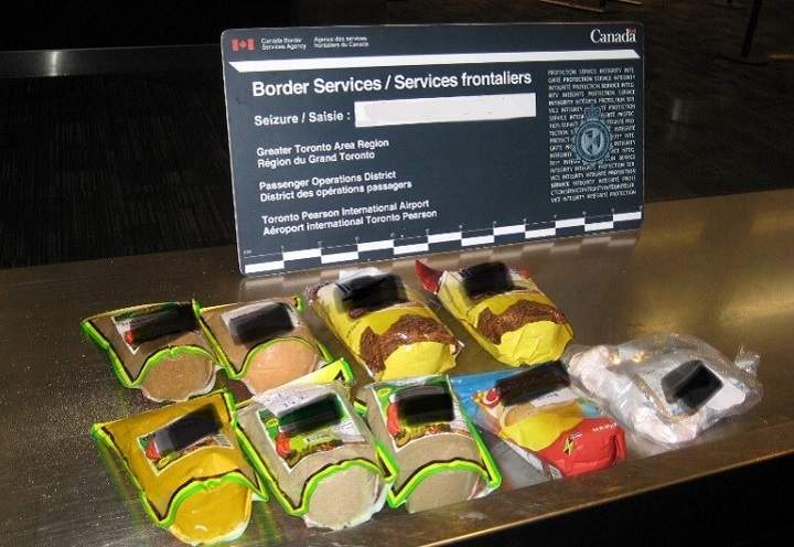 Officials show a sample of the products seized at Toronto Pearson International Airport.