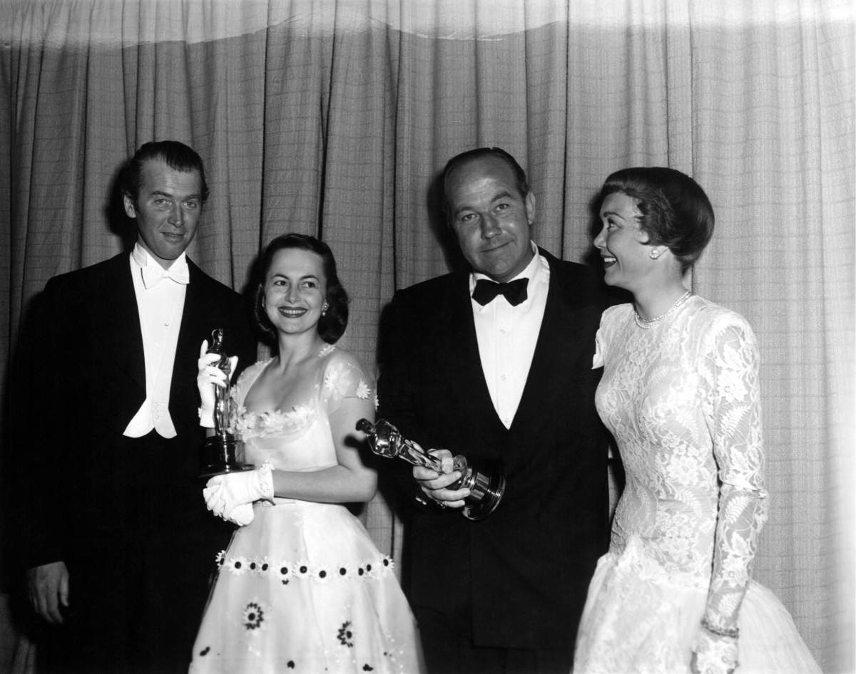 James Stewart presenting Olivia de Havilland the Oscar for Best Actress for THE HEIRESS and Jane Wyman presenting Broderick Crawford the Oscar for Best Actor for ALL THE KING’S MEN, 1950