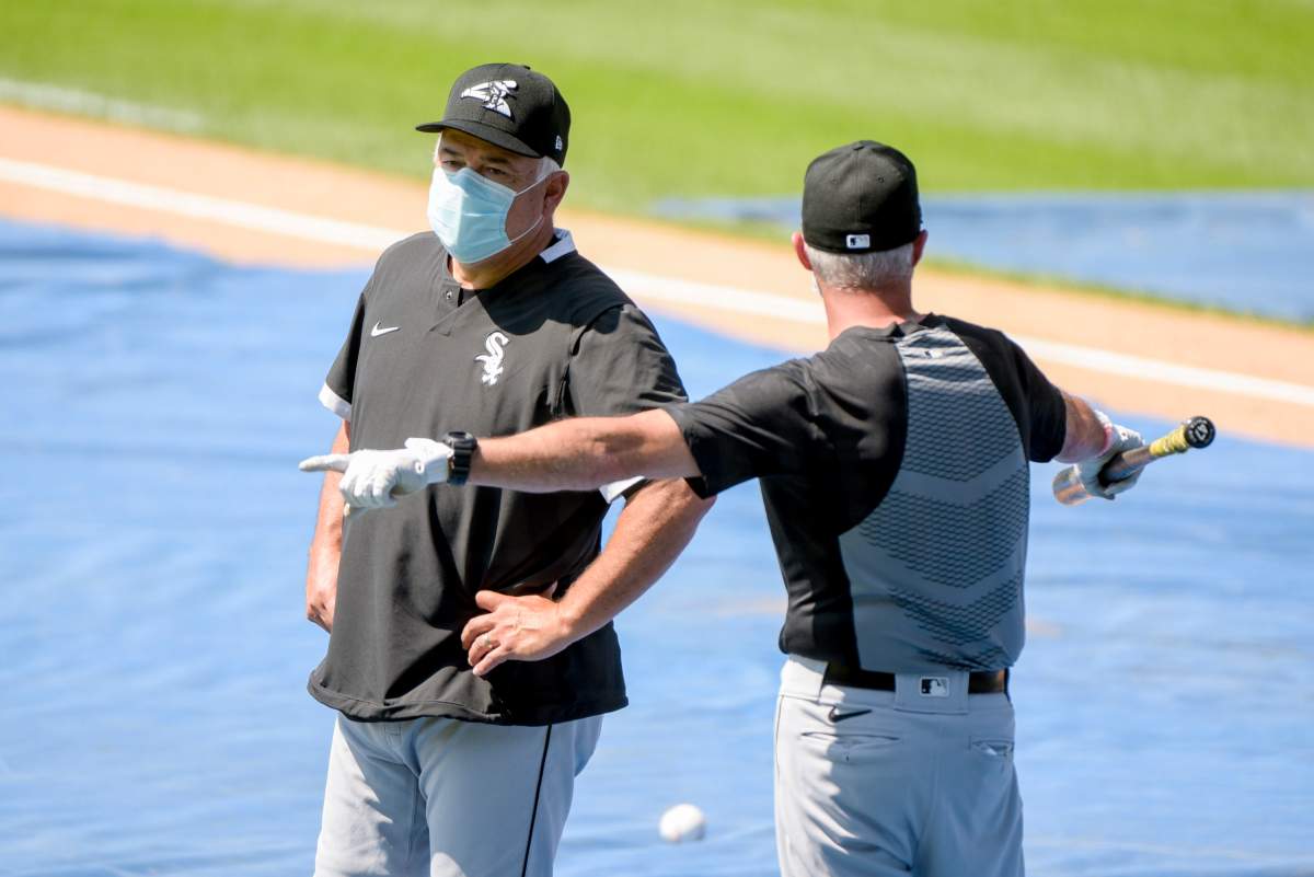 Chicago White Sox Manager Rick Renteria talks with a coach during the first baseball practice of the restarted 2020 MLB season at Guaranteed Rate Field on Friday, July 3, 2020, in Chicago.