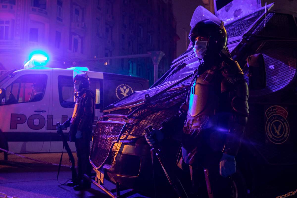 In this March 29, 2020 file photo, Egyptian security forces cordon off roads during curfew hours as prevention measures due to the coronavirus outbreak, in Cairo, Egypt.